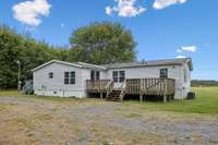Large back deck leading you into your spacious back yard.  1565 Eugene Reed Rd Woodbury TN 37190