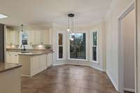 Kitchen freshly painted. Informal dining, bay window overlooking deck and backyard.