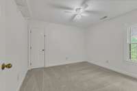 Bedroom 4 with door to walk in storage.