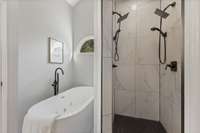 Luxurious spa-inspired design featuring a walk-in, multi-head shower and soaking tub side by side—creating the perfect space to unwind and rejuvenate.