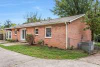 Back view of the house showing the patio and bay window.
