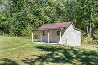 Finished out building with covered front porch
