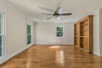 Living Room. Custom bookcase with hidden door
