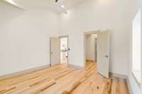 Primary bedroom with view into the closet