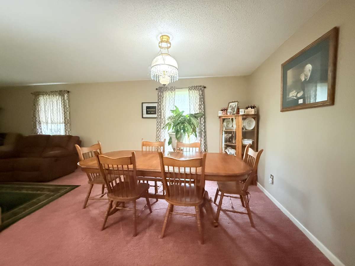 Combination Dining Room and Living Room overlooking front yard