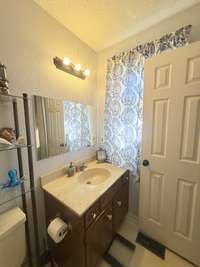 Primary Bedroom has a Half Bath overlooking the backyard