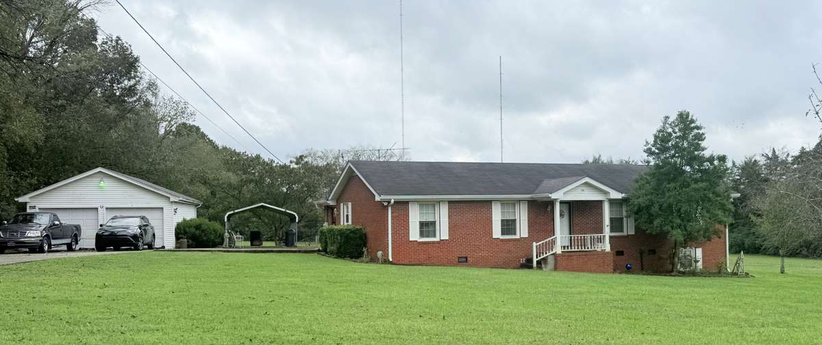 Beautiful home situated on 2 acres with 3 Bed 1.5 Baths with detached 2 car garage and carport;
