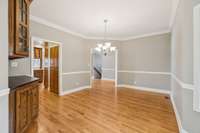 Formal dining room off of kitchen with built-in bar.