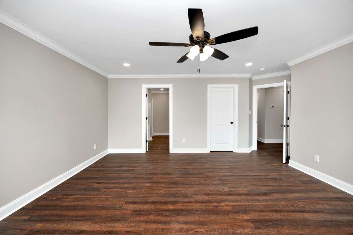 Primary Bedroom - LVP flooring, crown molding, ceiling fan, recessed lighting