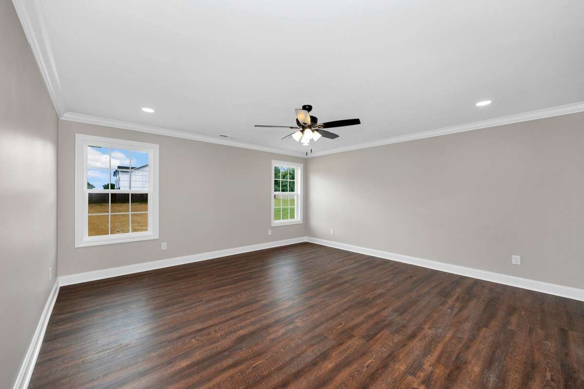 Primary Bedroom - LVP flooring, crown molding, ceiling fan, recessed lighting
