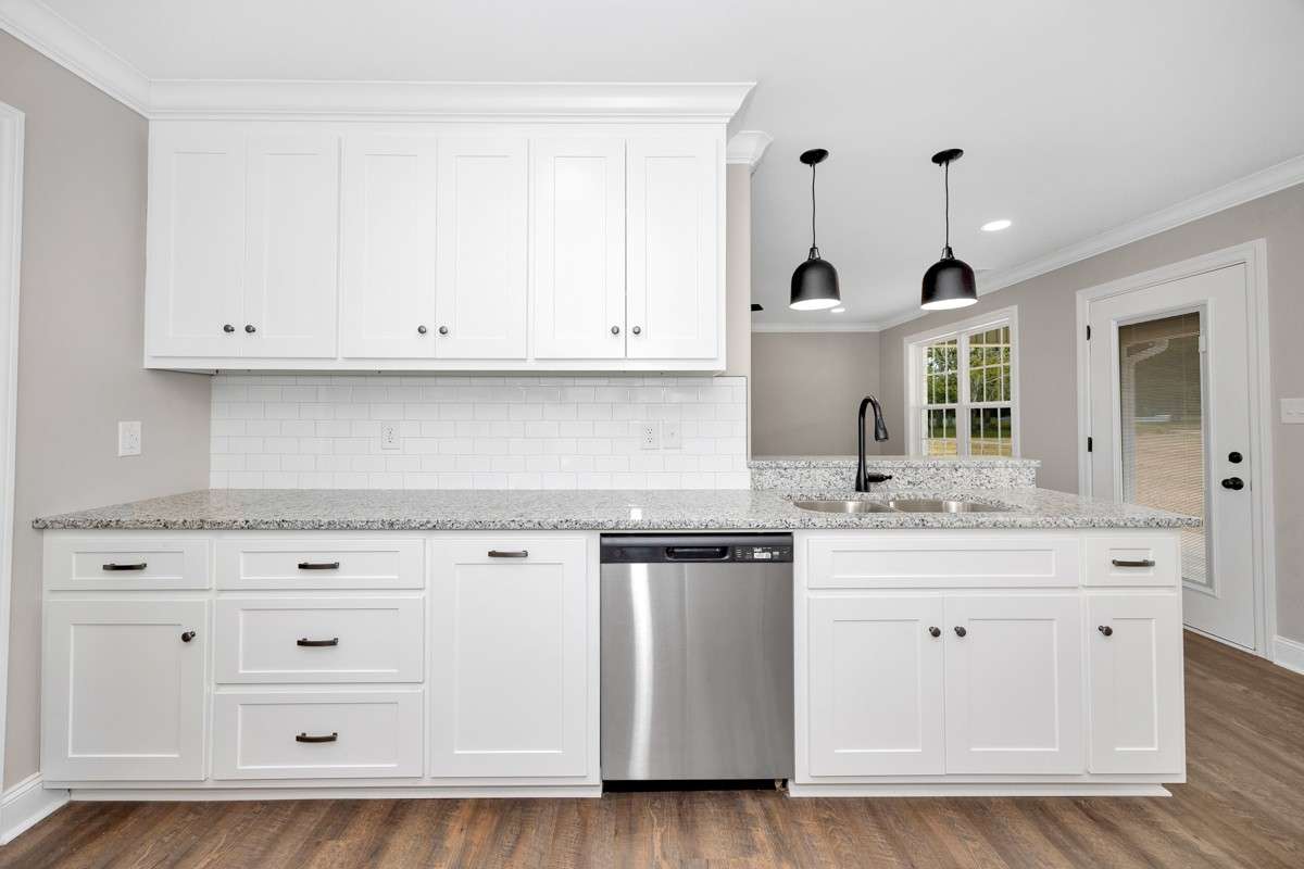 Kitchen- LVP flooring, granite countertops, pantry, recessed lighting, stainless steel appliances- dishwasher, refrigerator, stove/oven, microwave, crown molding
