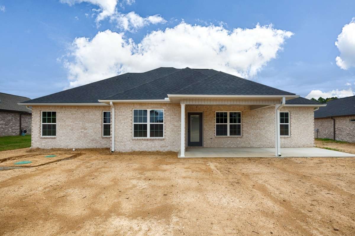 Back of house- covered patio with home entry, open patio