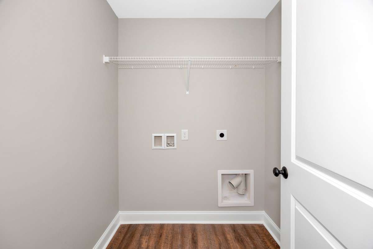 Laundry Room- LVP flooring, washer/dryer hookups, wire shelving for storage