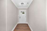Foyer- LVP flooring, crown molding