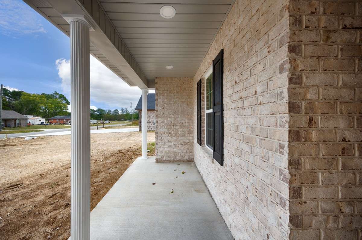 Front of house- covered front porch with home entry