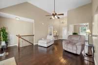 Another view of the open family room, with stairs leading to the finished basement.