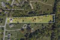 This home sits on 2.6 acres with plenty of open space and backs up to a small creek at the rear