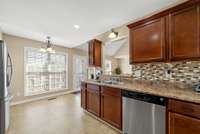 View into the eat-in area of the kitchen which has lots of natural lighting
