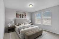 Bedroom 2 has two large picture windows which overlook the backyard.