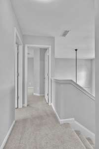 Upstairs landing with plush carpet throughout