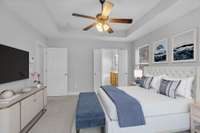 Double doors lead to the private ensuite bathroom.