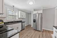 There is a pantry closet and exterior entry just around the corner from the refrigerator.