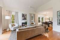 Living room and separated dining room space that leads into the kitchen