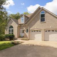 Virtually enhanced front photo to update the landscaping - welcome to 8013 Boone Trace in Boone Trace