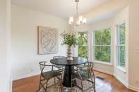 Eat-in kitchen with bay window that overlooks the back of the property