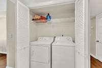 In-unit hall laundry w/storage shelf