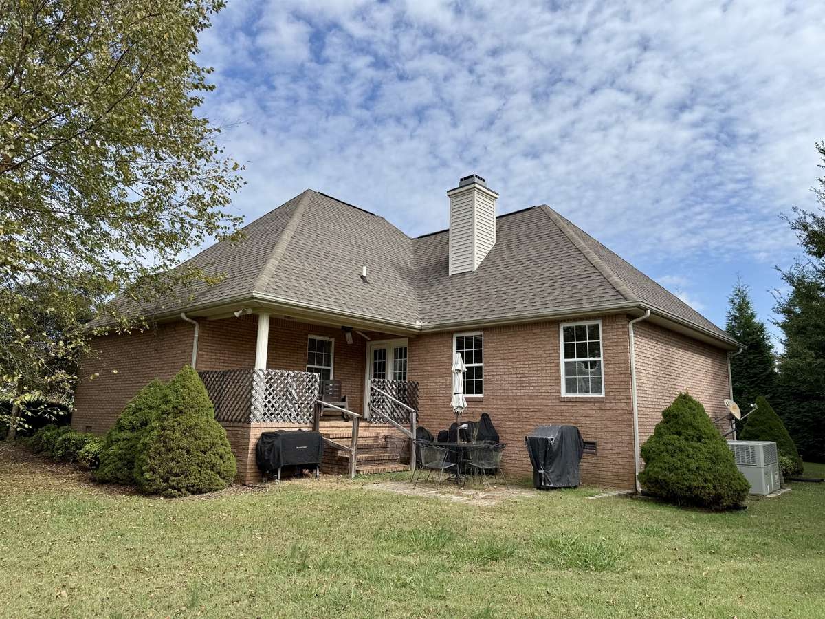 Back covered porch and patio area.