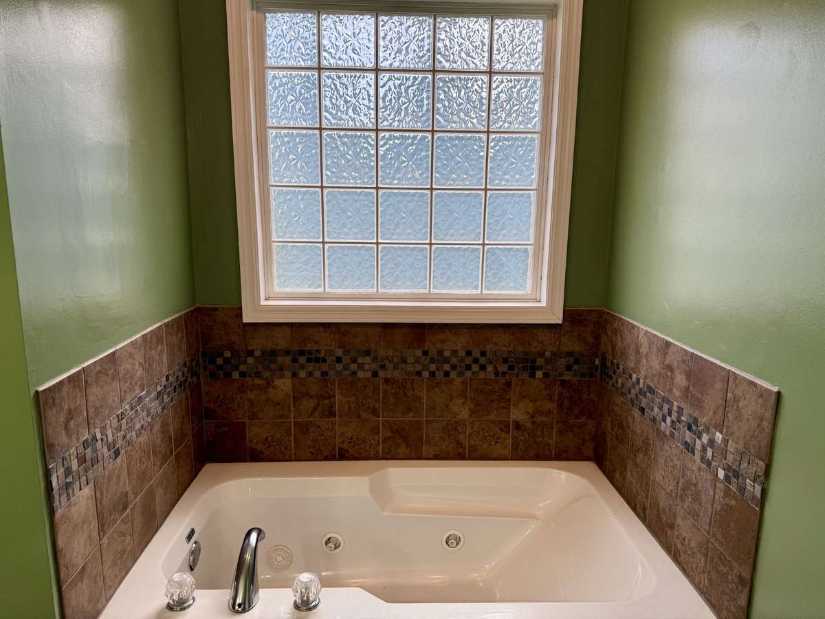 Jacuzzi tub in primary bathroom.