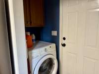 Laundry area off of kitchen.