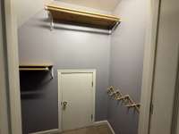 Upstairs walk-in closet with access to the attic.