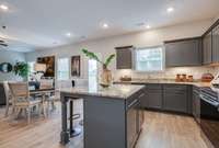 Kitchen.

*Photos are from a staged model home of floor plan. Options and Selections may vary in actual home.
