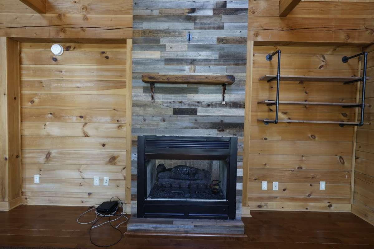 Pass through gas log fireplace