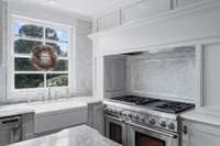 The kitchen was designed with hidden storage so that the chef has everything at their fingertips.