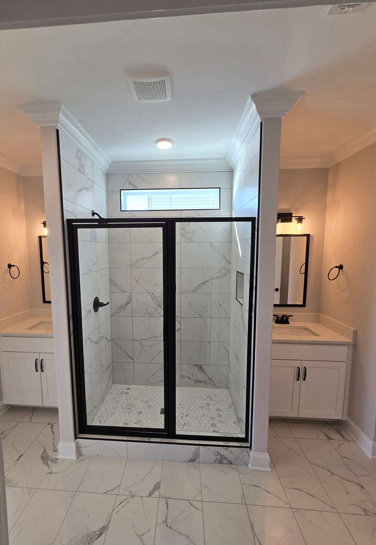 Master bathroom divided sinks. Natural lighting. Huge closet with wood shelving. Linen closet.