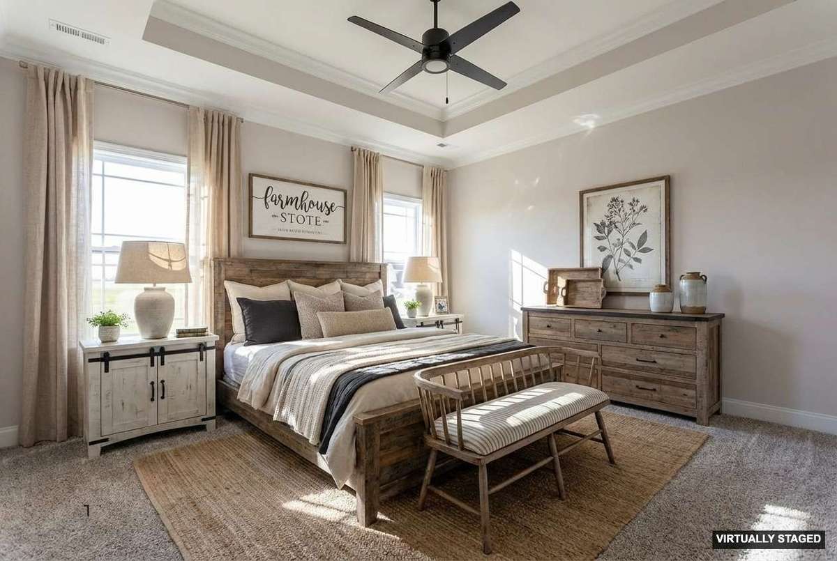 Master bedroom with trey ceiling and crown molding.