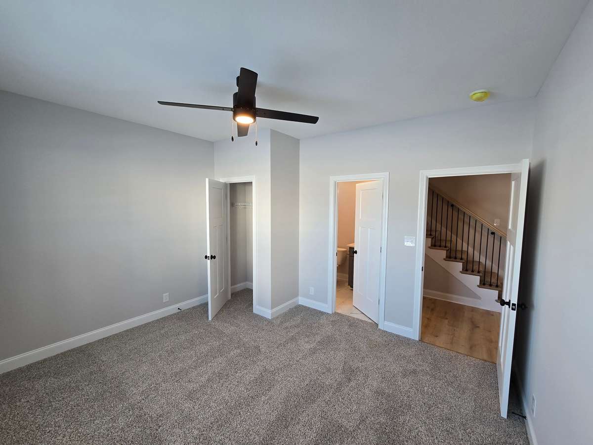 Another view of 2nd bedroom downstairs with door leading to full-bathroom/Guest bathroom.