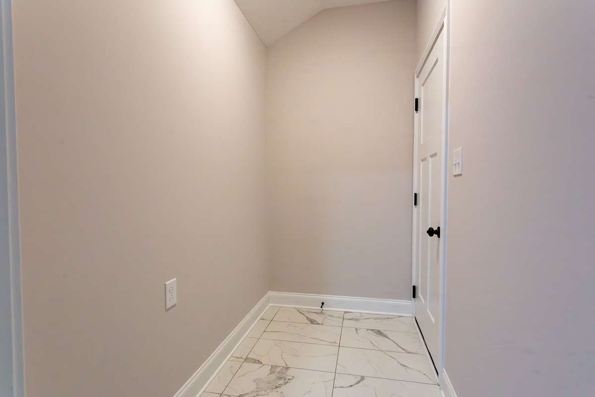 Second part of the laundry room coming in from the garage.