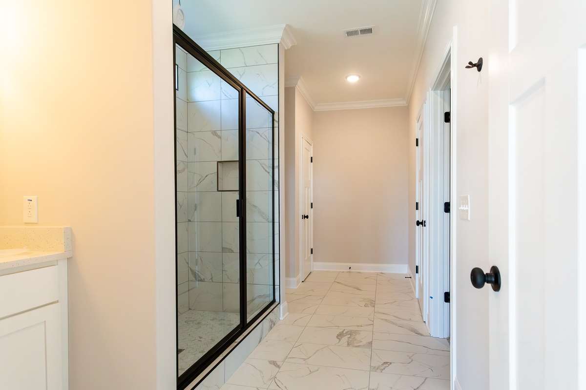 Master Bath. Crown Molding Between the shower there are separate vanities.