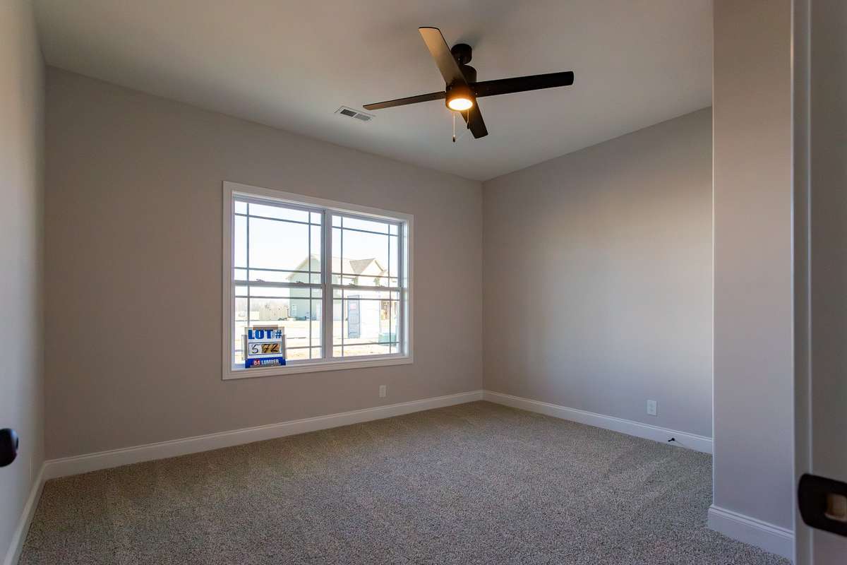 Second bedroom on the main floor. Perfect for company, New baby, In-laws, or maybe an office. The bedroom has it's own door to the full bathroom.