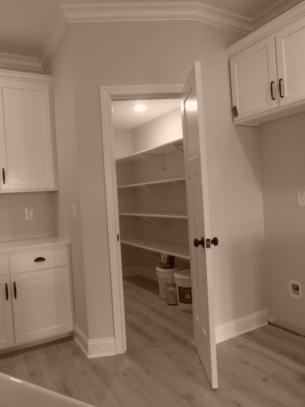 Huge pantry with wood shelving.