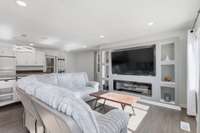 built in bookshelves and TV console with electric fireplace in your new living room