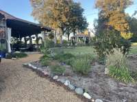 Looking from the driveway to the backyard