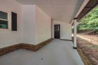 Plenty of covered parking and a large storage shed in the back area.