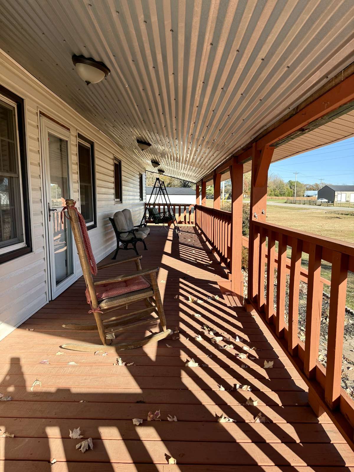 Enjoy watching the sunrise in the mornings from this Front Porch. (Measures 7.8' x 47.7' with 372 SF)