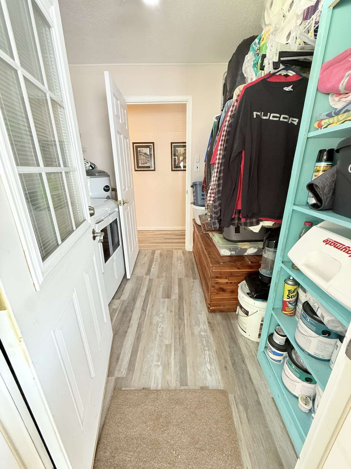 Another rear entry is to this 8x8 Utility Room/Mud Room with Washer/Dryer hookup, Water heater on one wall and the other wall for extra storage or even room for a freezer.
