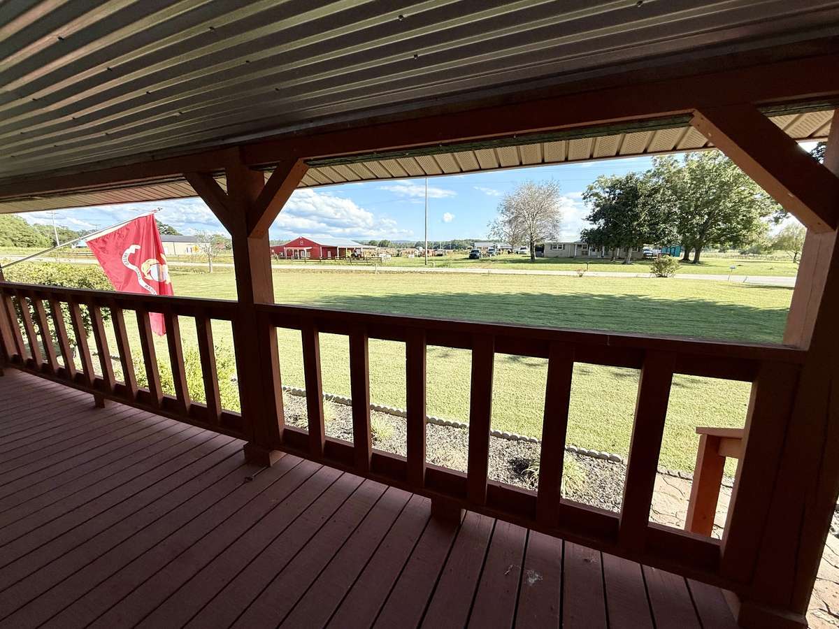 From the covered Front Porch is this beautiful view of the Cumberland Plateau in the distance.  Front Porch measures 7.8'x47.7' Enjoy morning sunrises here!